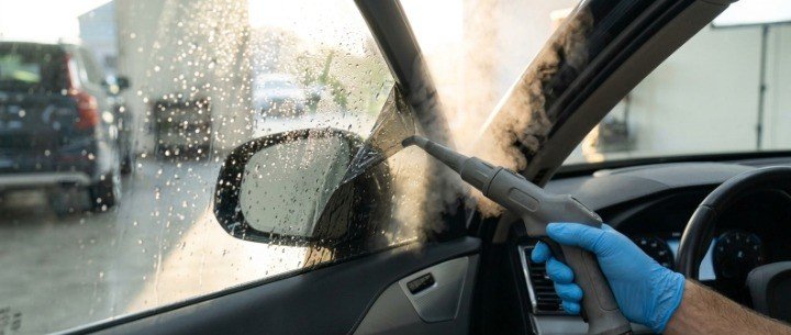Using a steamer to remove tinted window film from a car safely