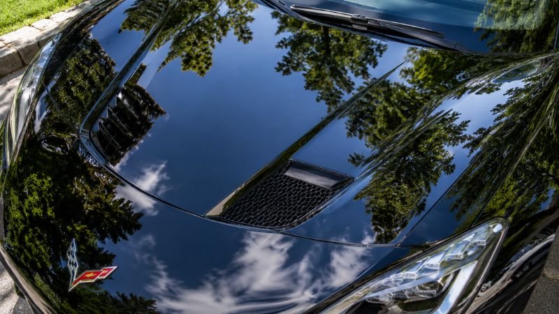 protective wax coating layer on glossy car paint