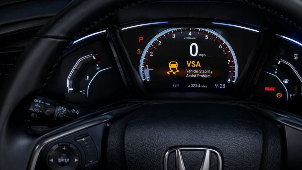 Illuminated yellow VSA light on a Honda Accord dashboard instrument panel
